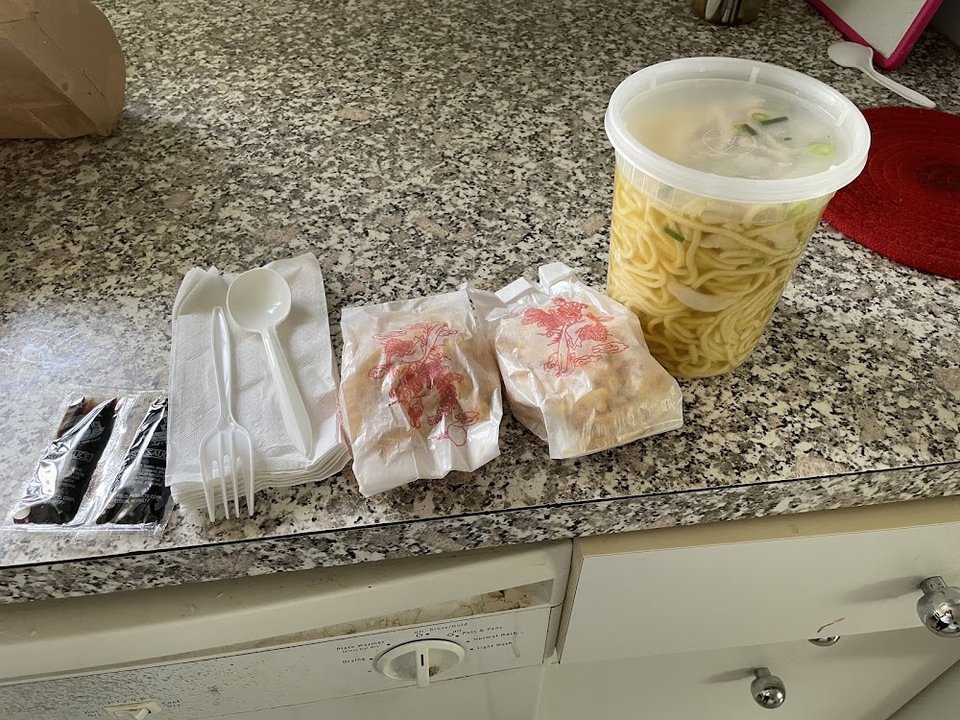 Printed menu page with Chinese dishes and sections.