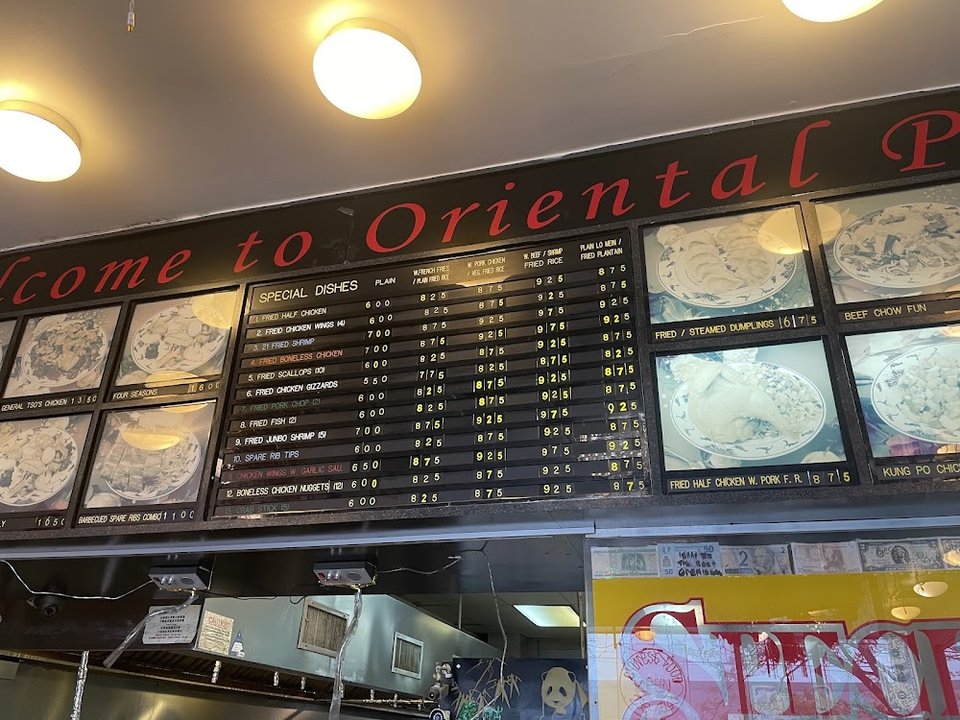 Printed menu page with Chinese dishes and sections.